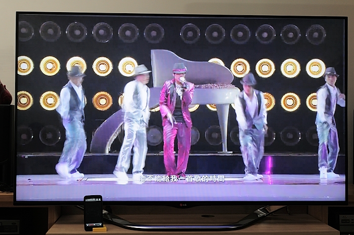 people stand in front of a piano on tv