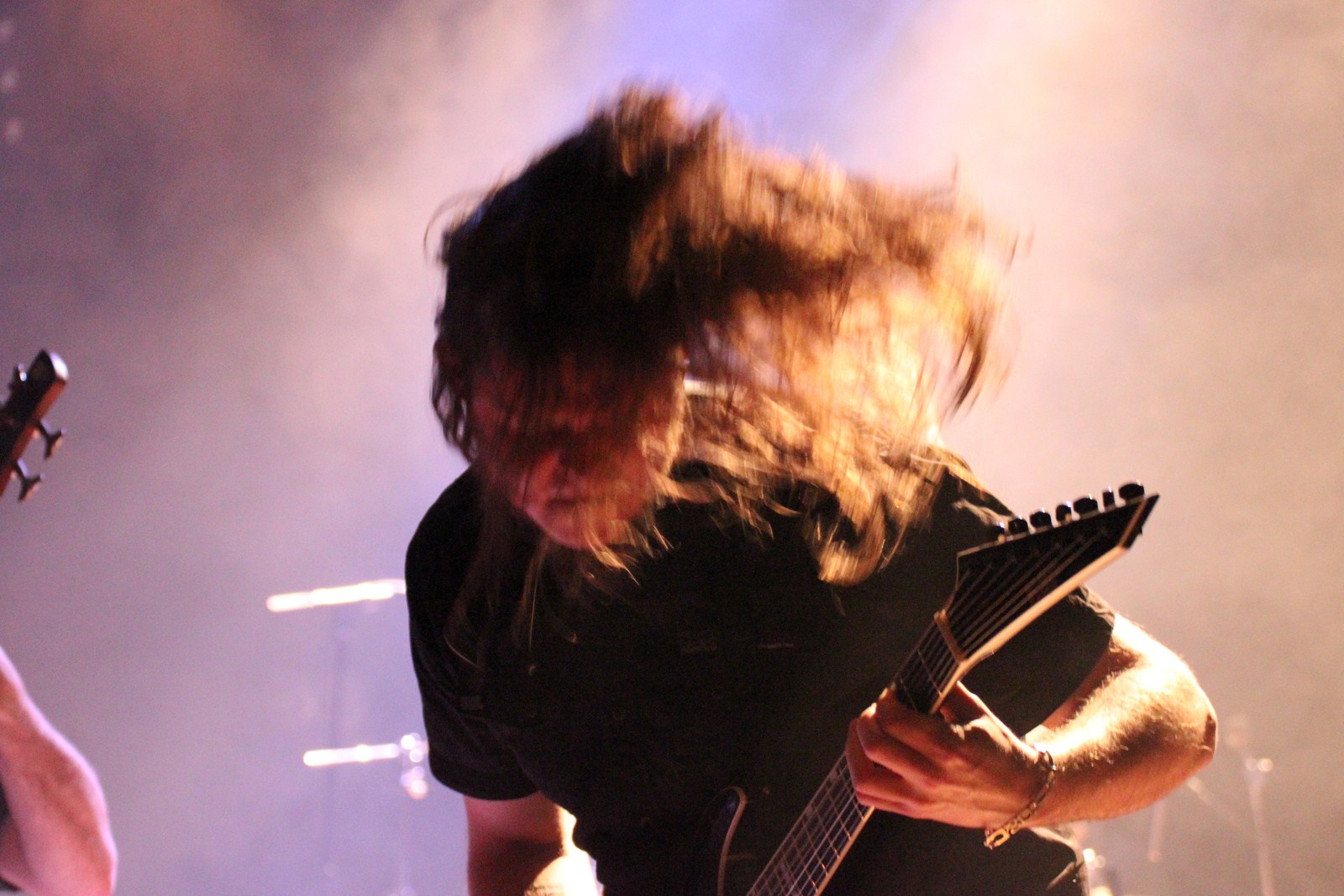 an image of man playing the guitar on stage