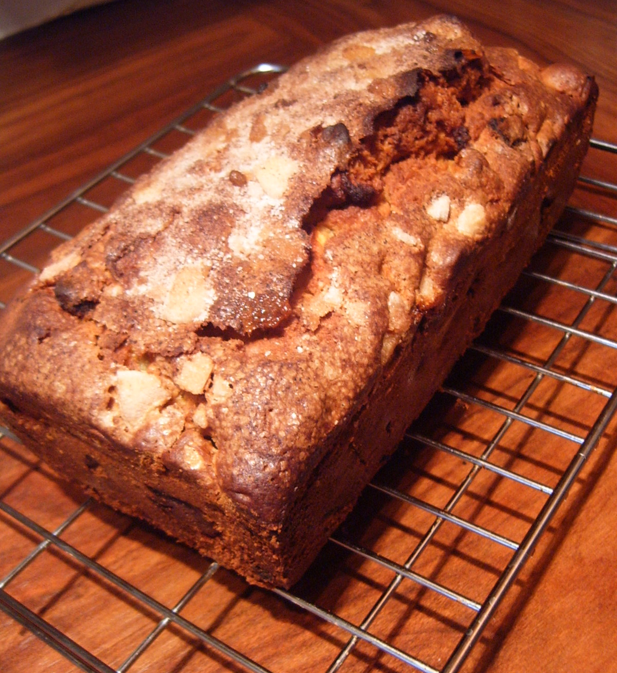 a freshly baked loaf of bread cooling on the rack