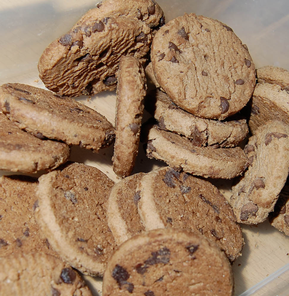 there are several cookies in a plastic container