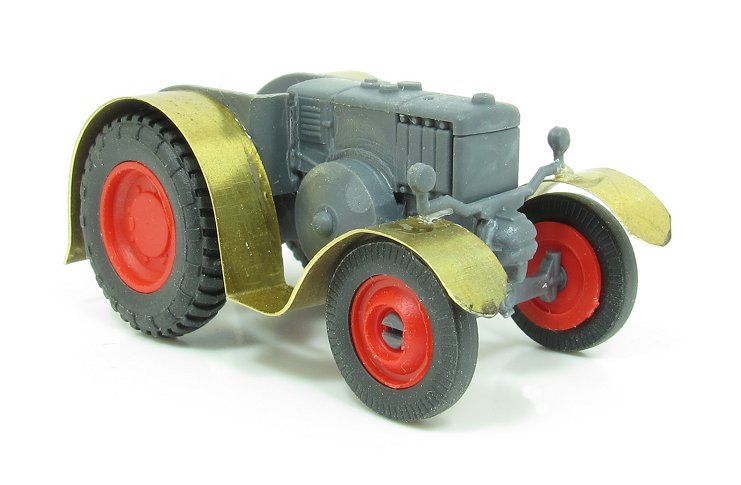 toy tractor, made from paper and yellow wheel