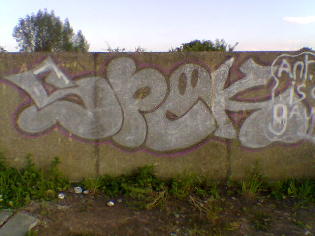 an image of graffiti on the side of a wall