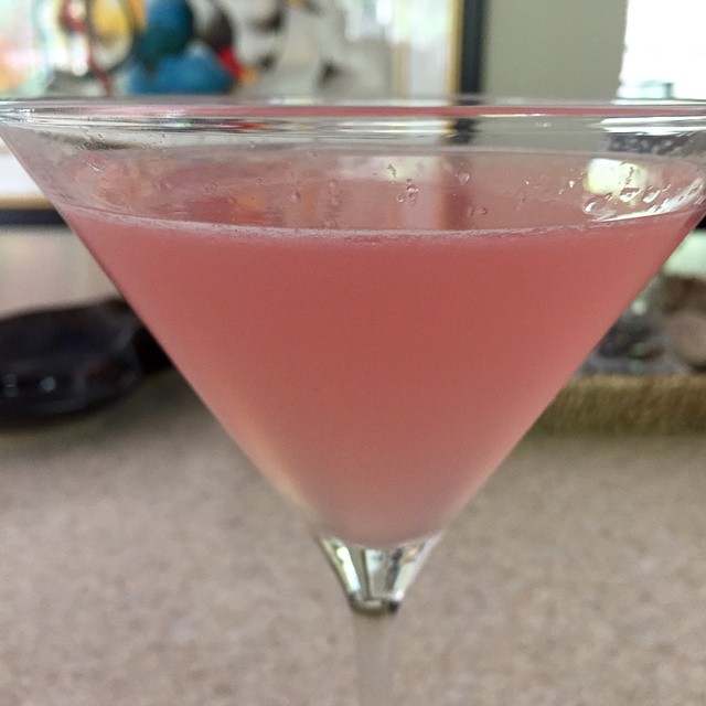 pink drink in a glass on a counter