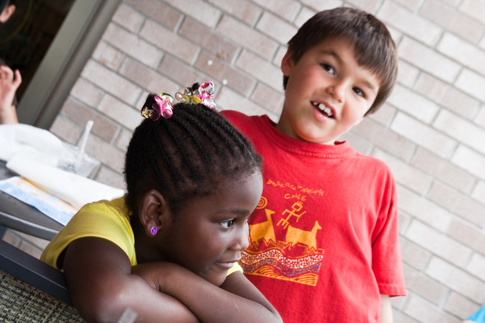 two children are standing near one another