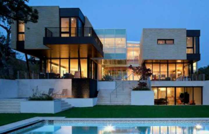 a modern house with pool and large windows