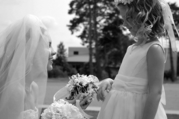 two girls in white dresses getting ready to go to their wedding