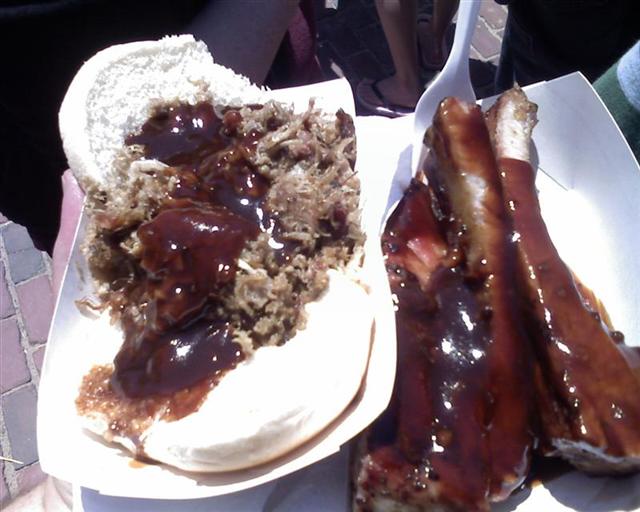 meat and bread on plates sit next to each other