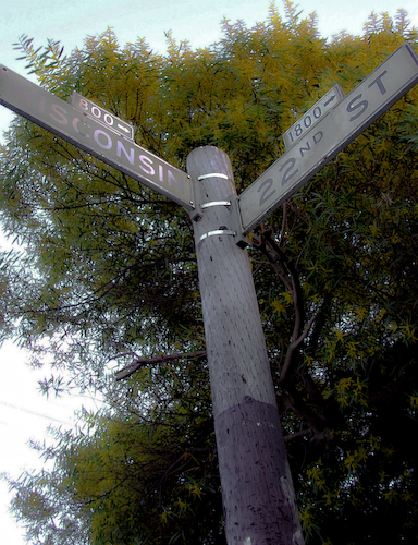 one street corner sign on the pole, at a corner