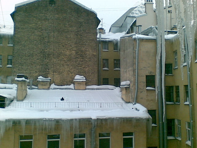 a snow covered rooftop on a snowy day