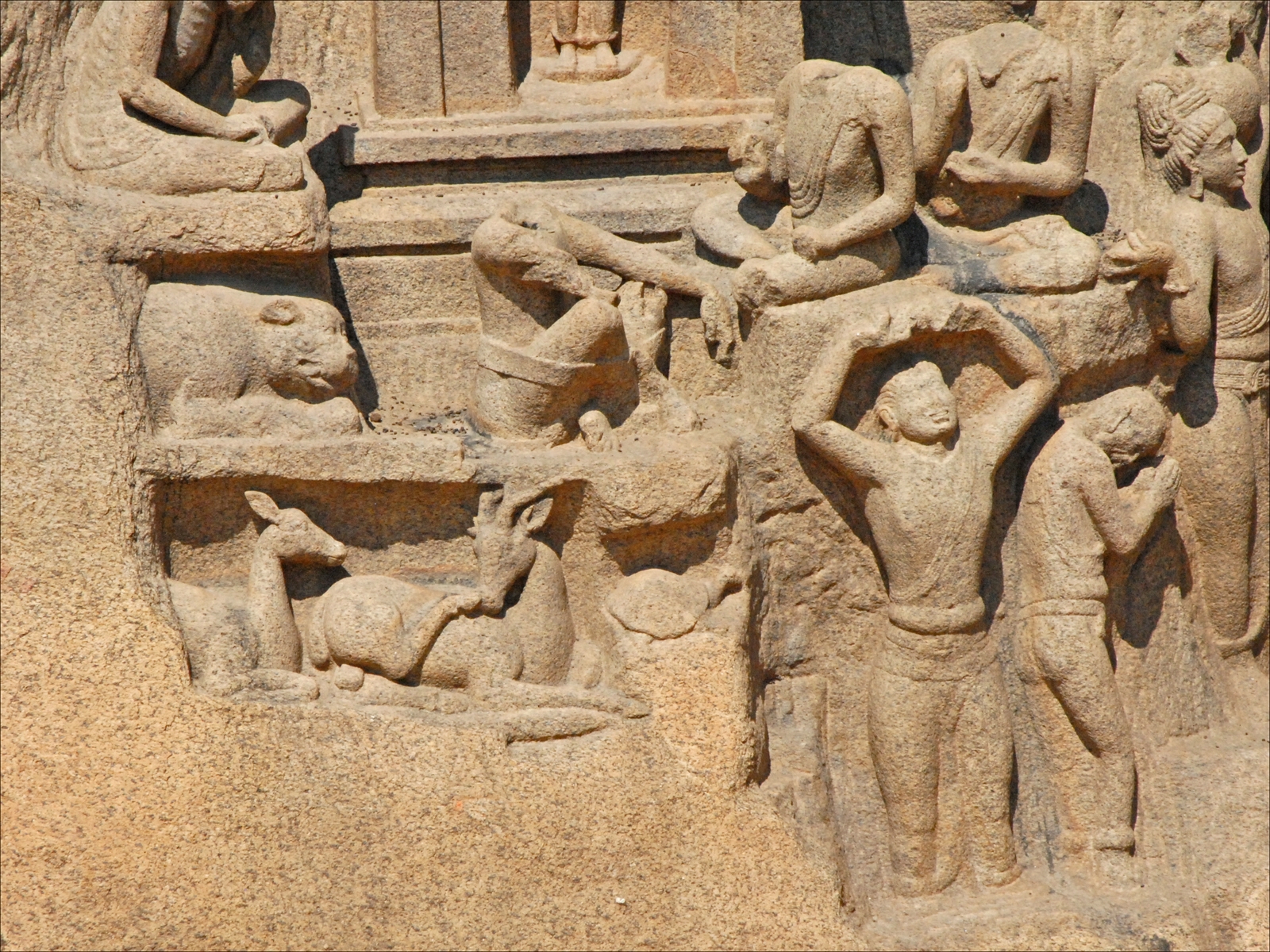 a large wall sculpture with several people on it