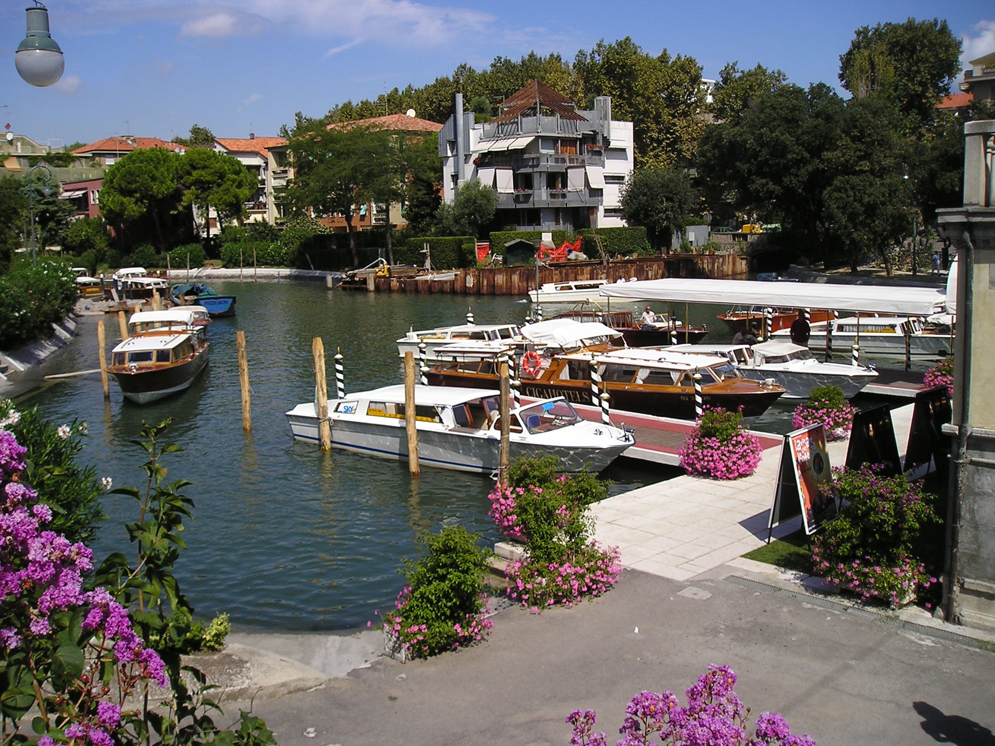 boats are docked in the water of a river