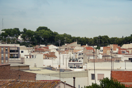 view over rooftops of a city in the daytime