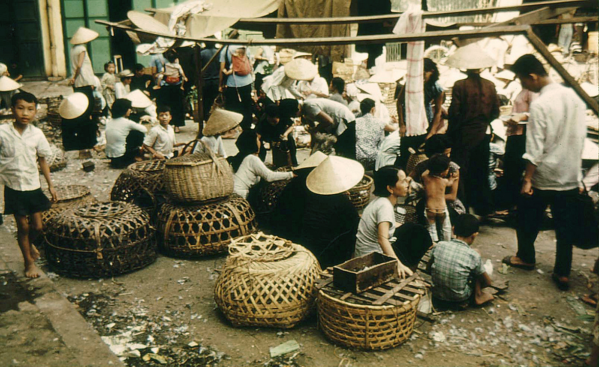 many people are building bamboo baskets in the street