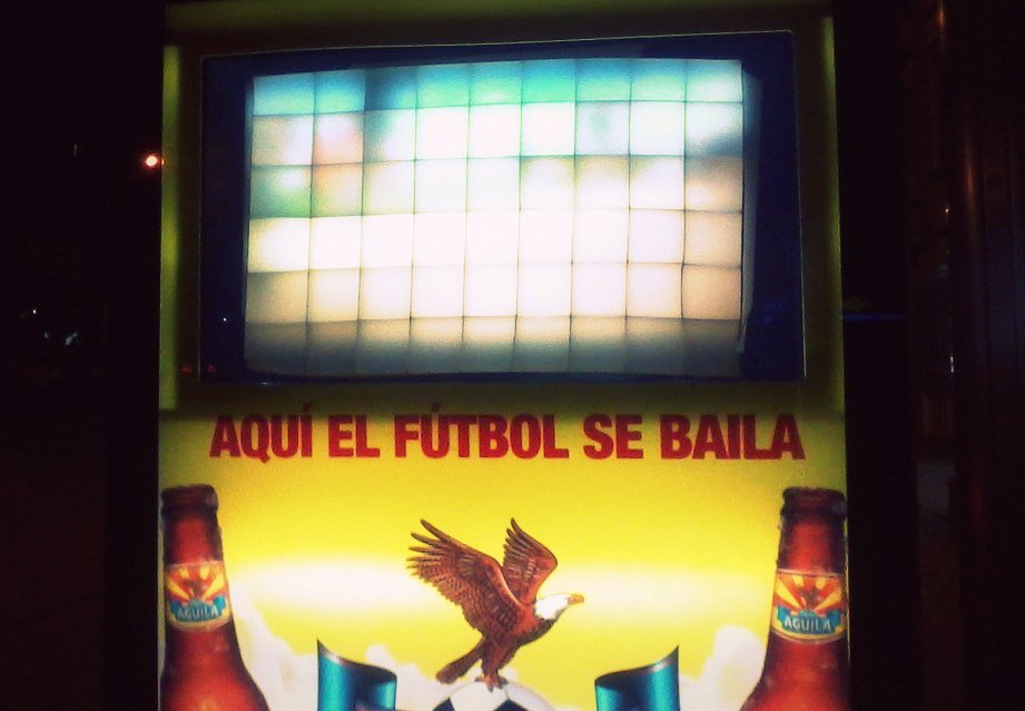 a beer advertit is displayed on a machine