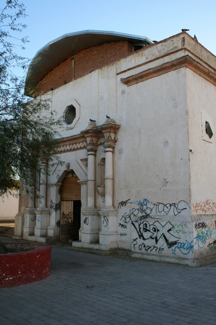 the large building has graffiti all over it
