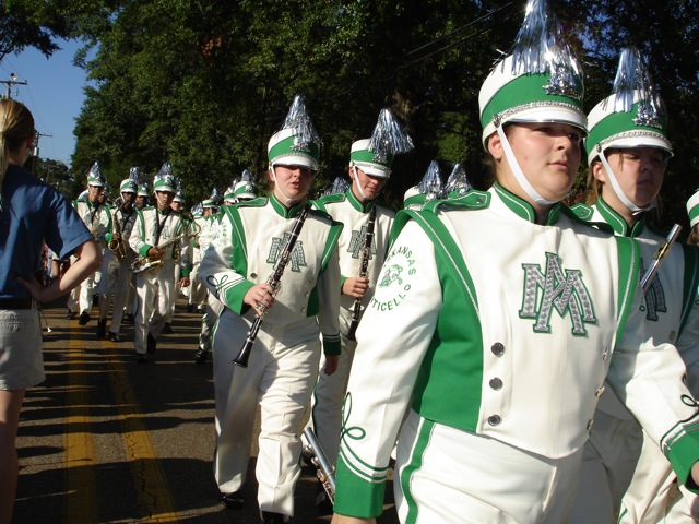 a marching band marching down the road in a parade