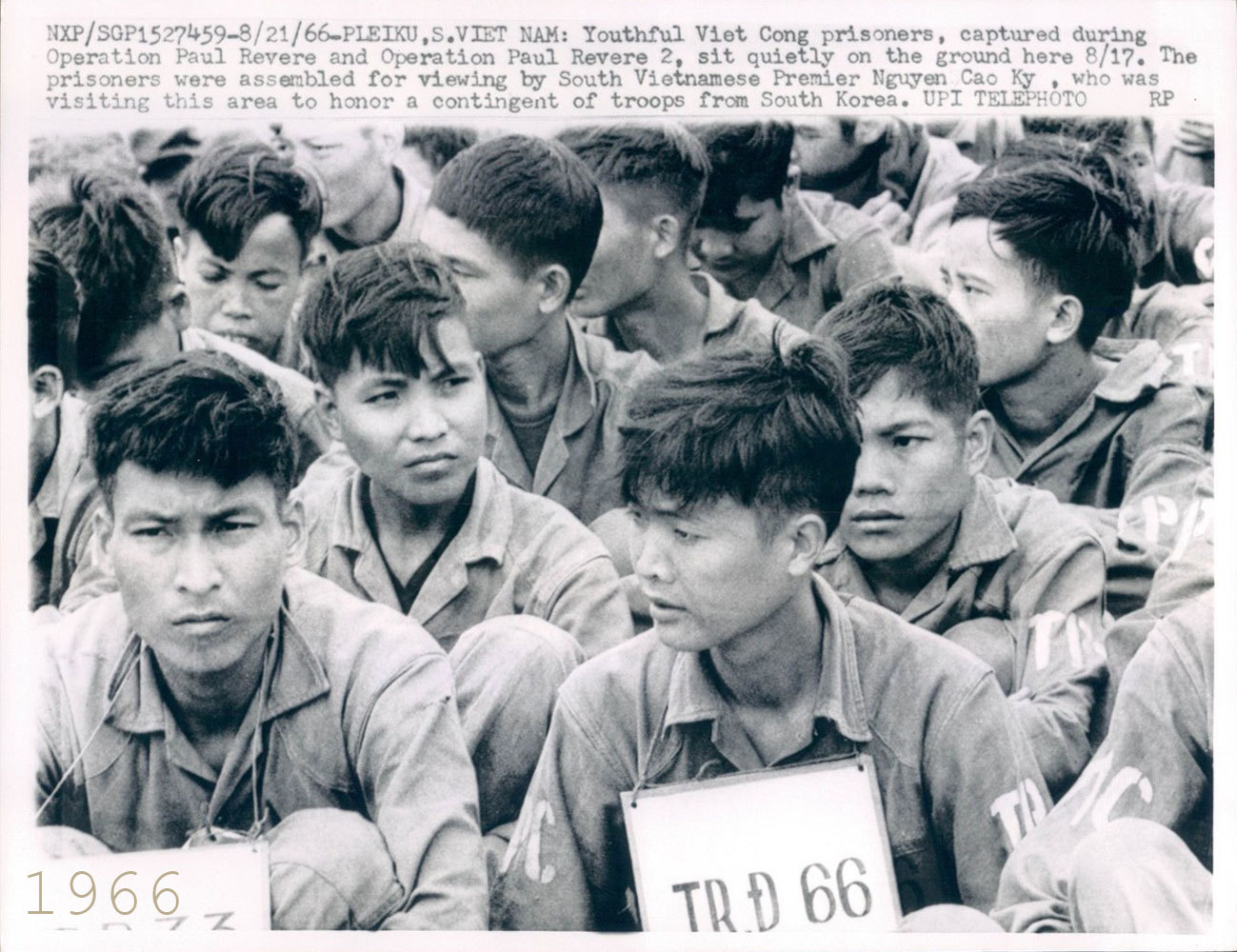 an old po of boys in uniforms holding signs