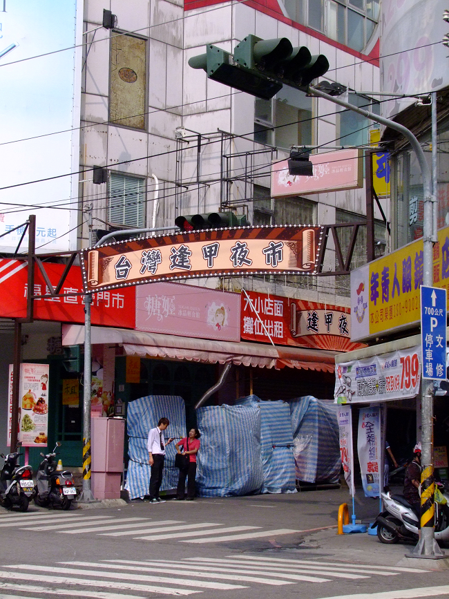 this is an image of a city street scene with cars