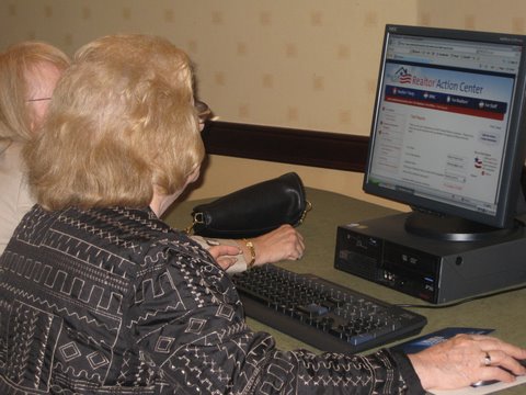 two ladies using a computer to display the internet