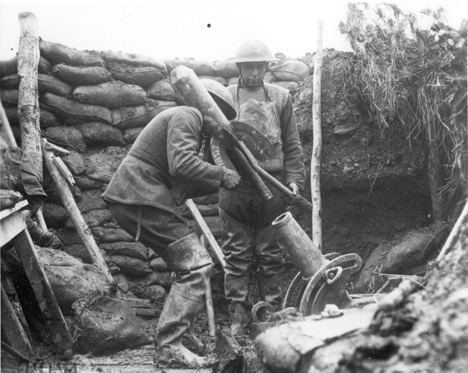 a man with a shovel standing near an area filled with rubble