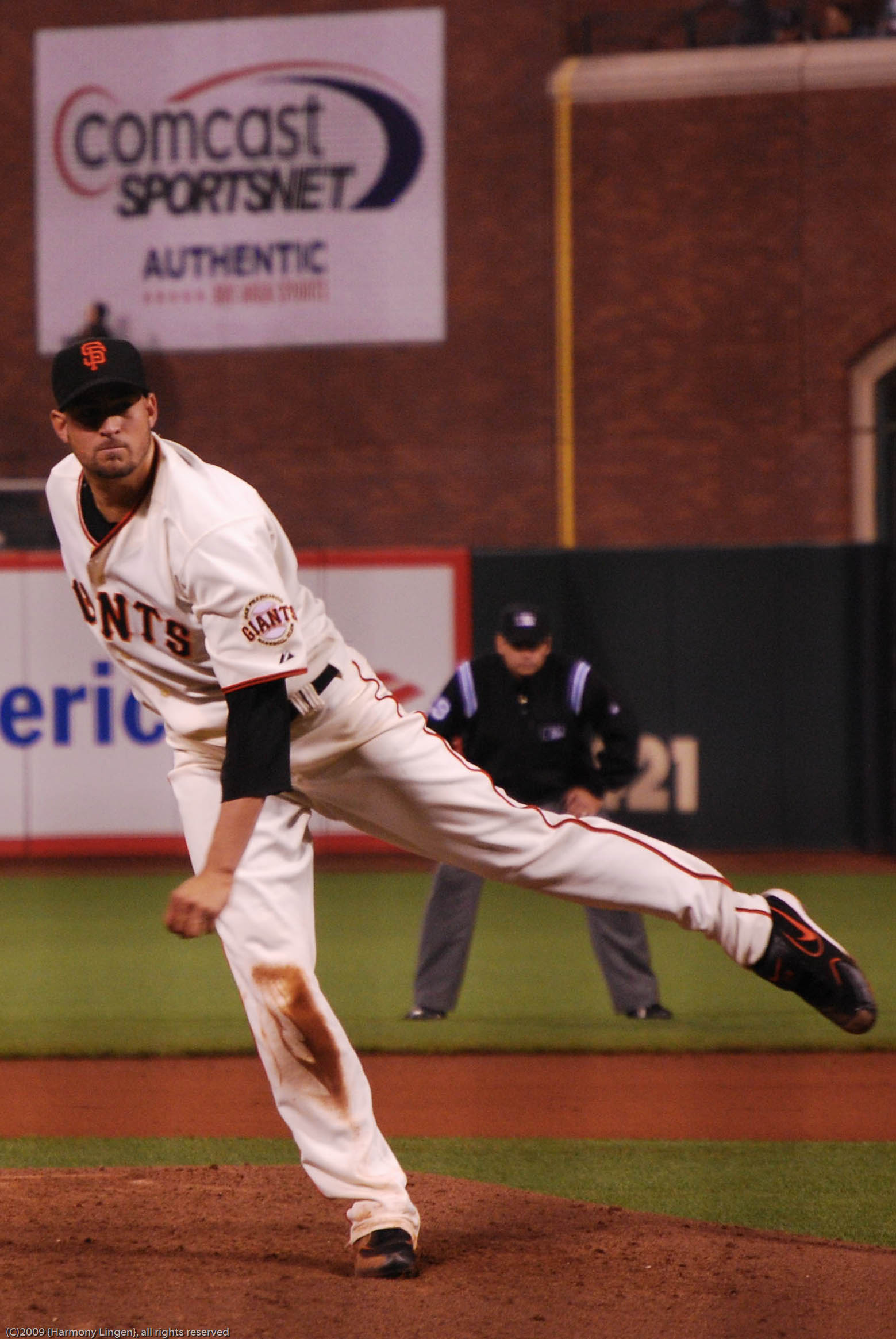 a professional baseball player throwing a ball on the mound