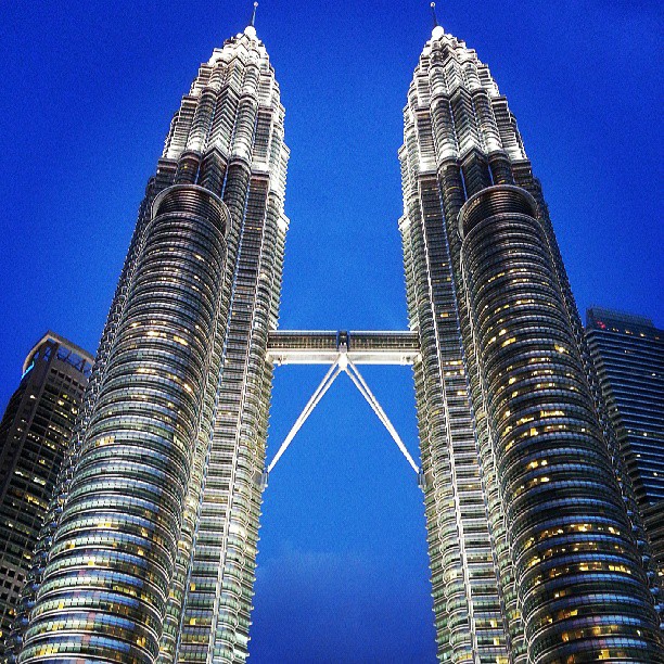 a big tall building with two towers at night