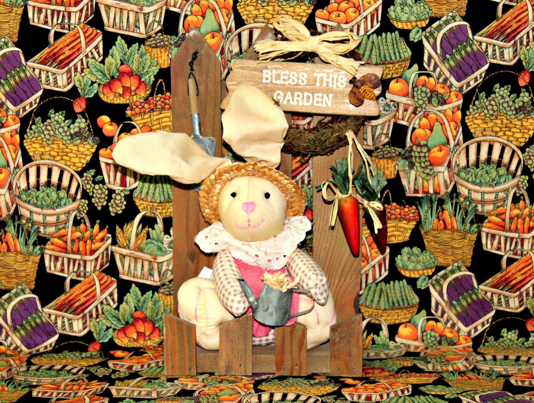 a rabbit doll sitting on top of a wooden chair