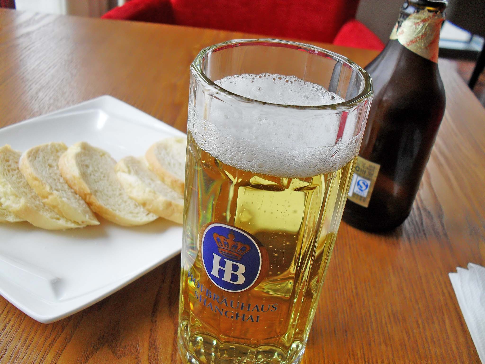 a plate with ers and a beer glass on a table