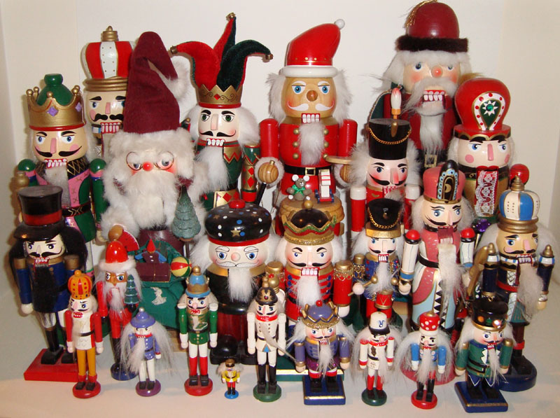 an assortment of nuters and figurines displayed on a white surface