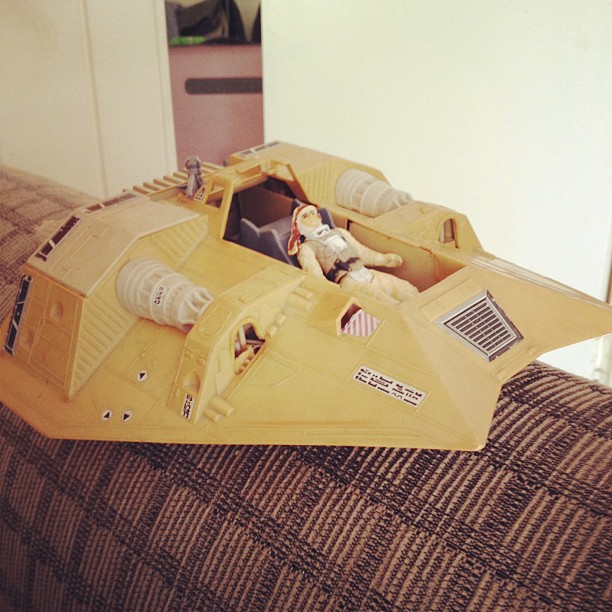 a paper model vehicle sitting on top of a couch