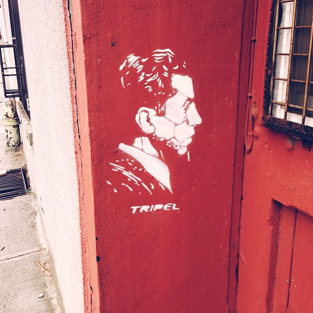 a door has a stencil of a man painted on it
