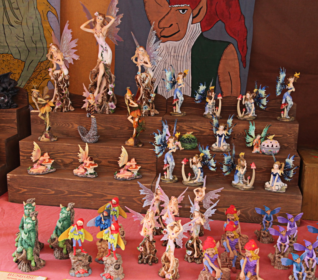 a collection of figurines of different sizes and colors