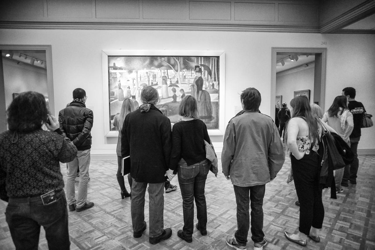 some people are looking at art in a museum