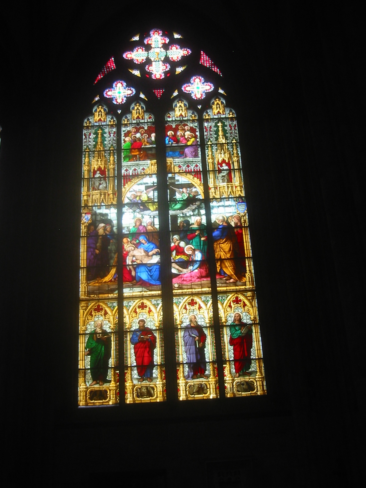 an ornately designed window depicting nativitys at night