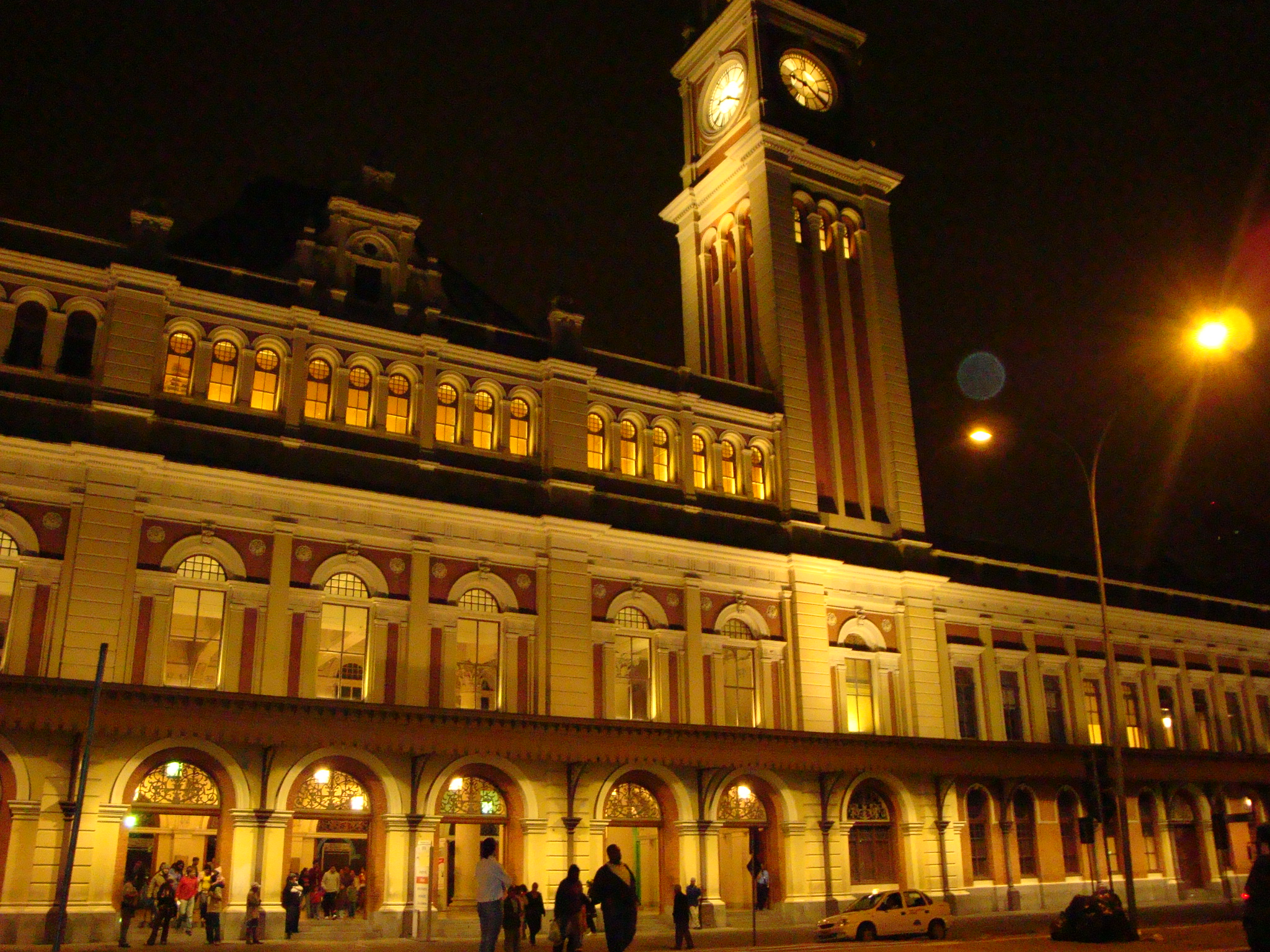 a large clock tower sits over the front of a building
