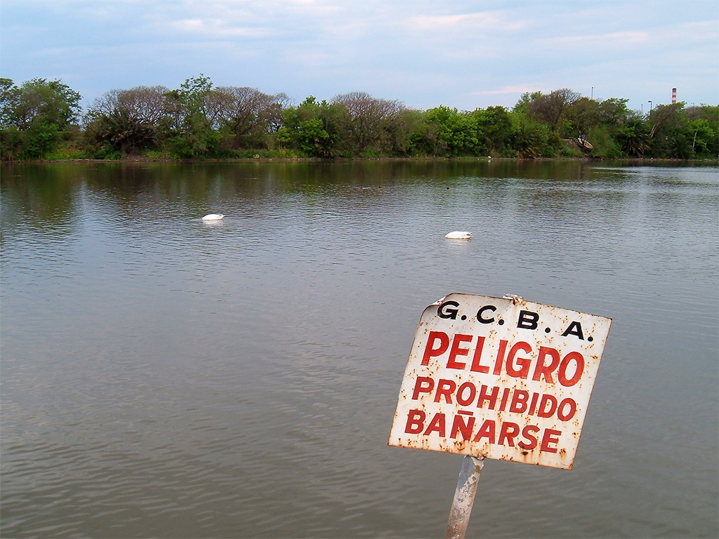 a sign that is in the middle of the water