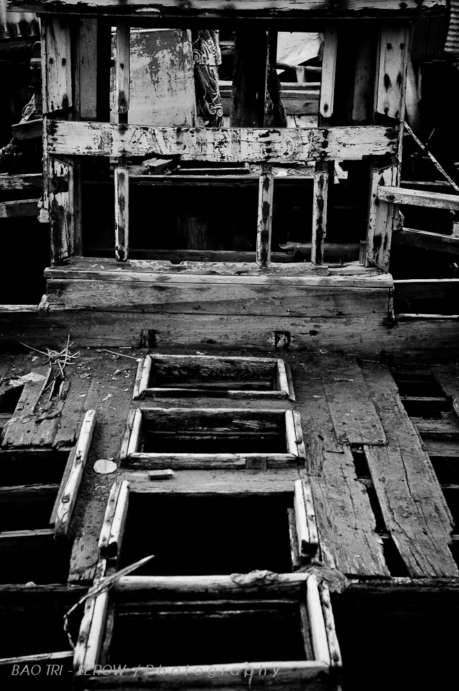 a dilapidated house is seen in the black and white po