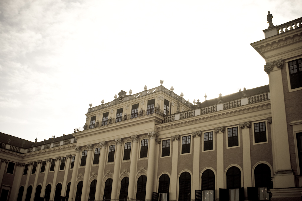 the outside of a large tan building with multiple stories