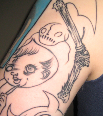 a tattoo of a child with a skull holding an umbrella