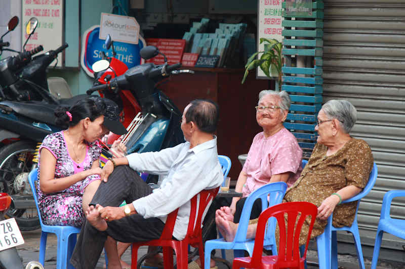 a group of people that are sitting on some chairs