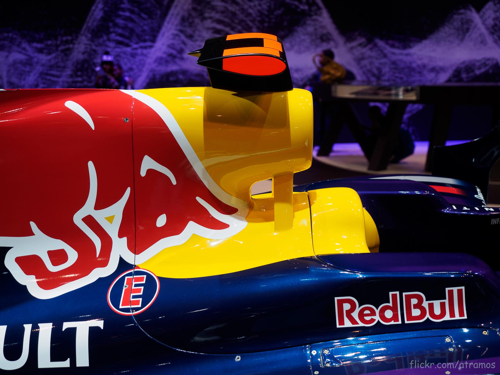 a red bull red bull racing car sitting in a pit