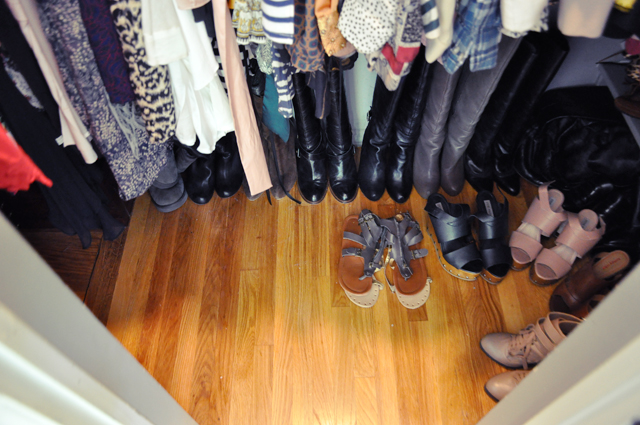 there is a room with many women's shoes and coats on the racks