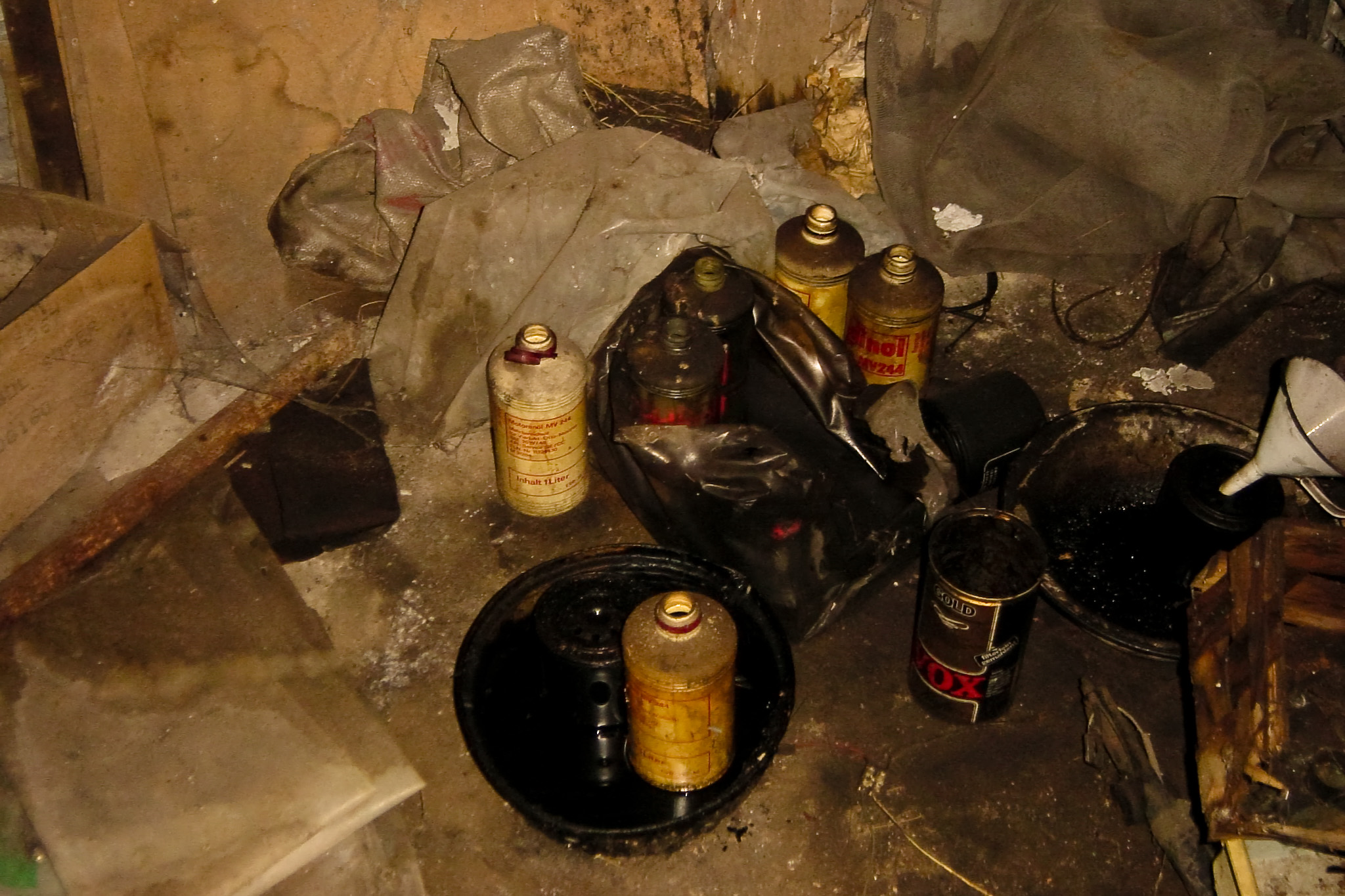 bottles are sitting in a pile on the ground