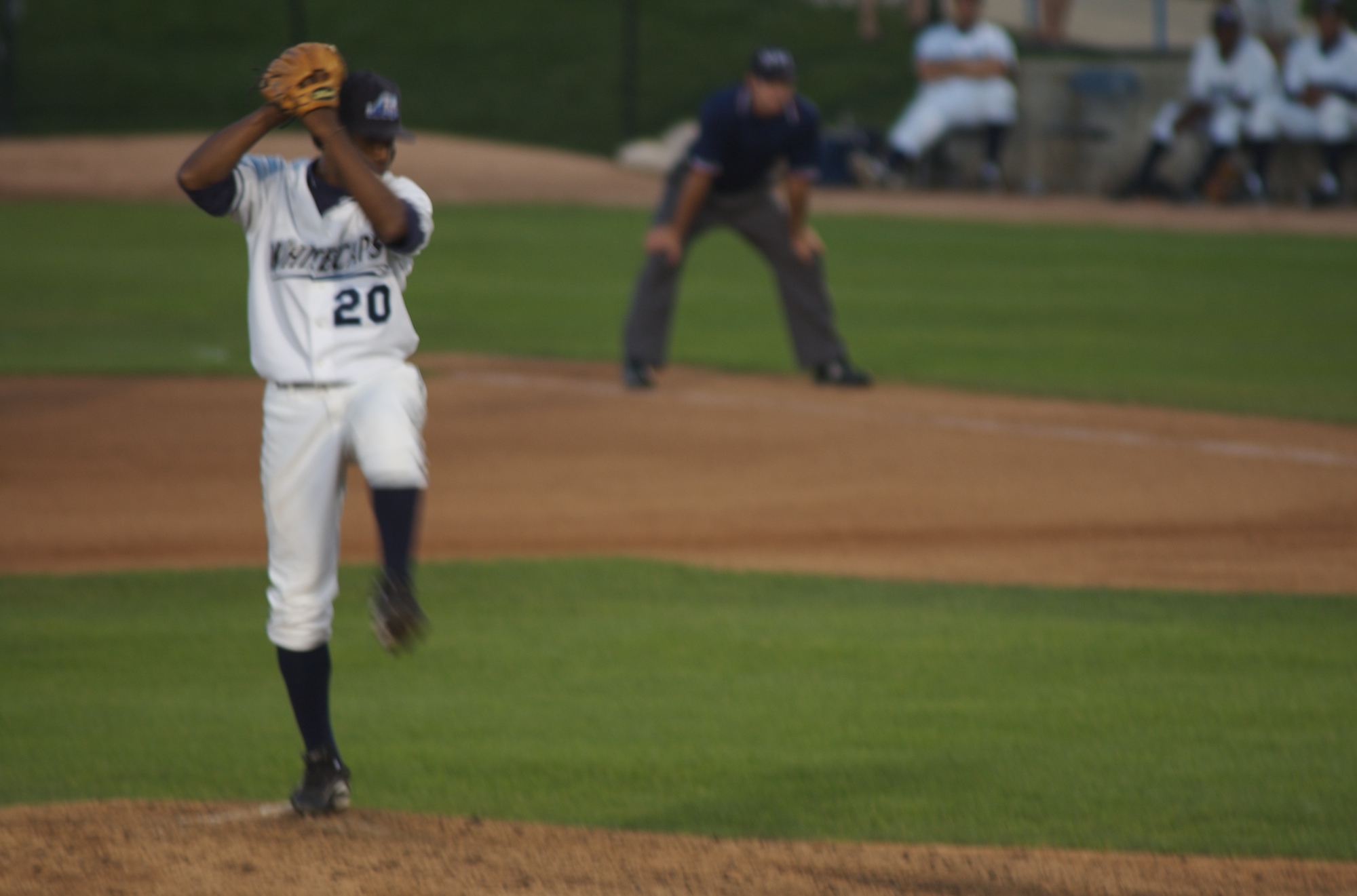 the baseball player is waiting to pitch the ball