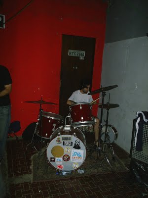 several people are playing with instruments inside a room