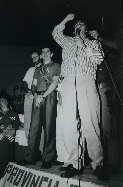 a group of men standing on top of a stage