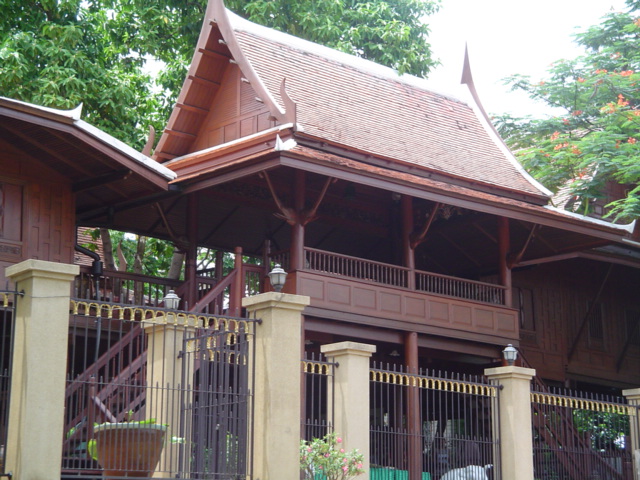 a very ornate house with a wooden roof