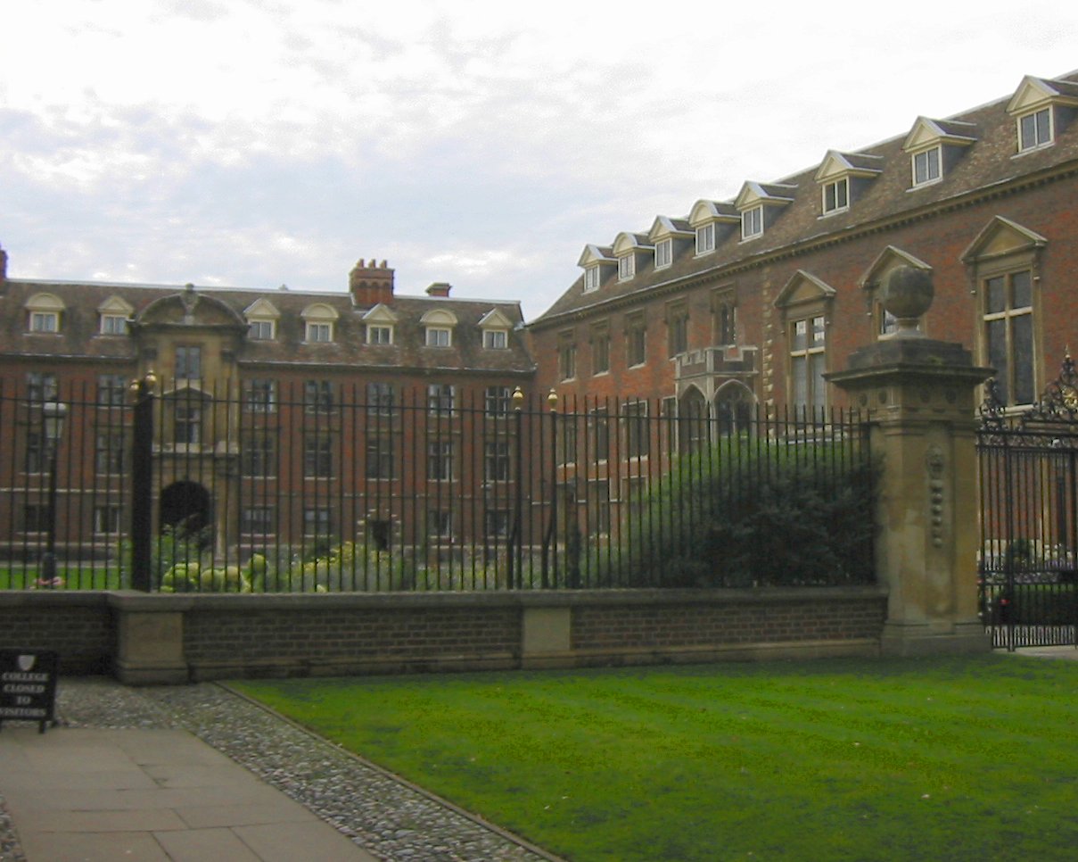 a large building in front of some very big gates