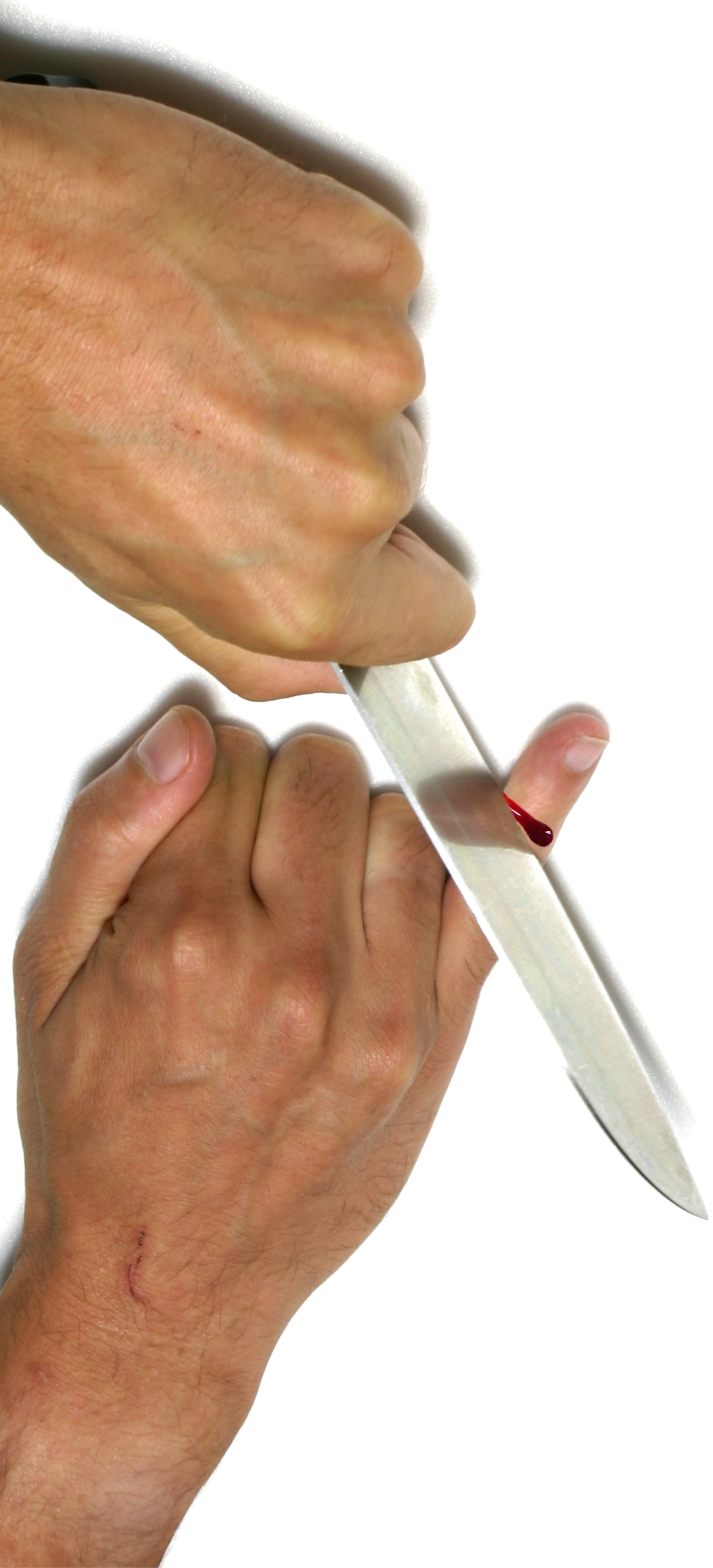 two hands  soing with a large pair of scissors