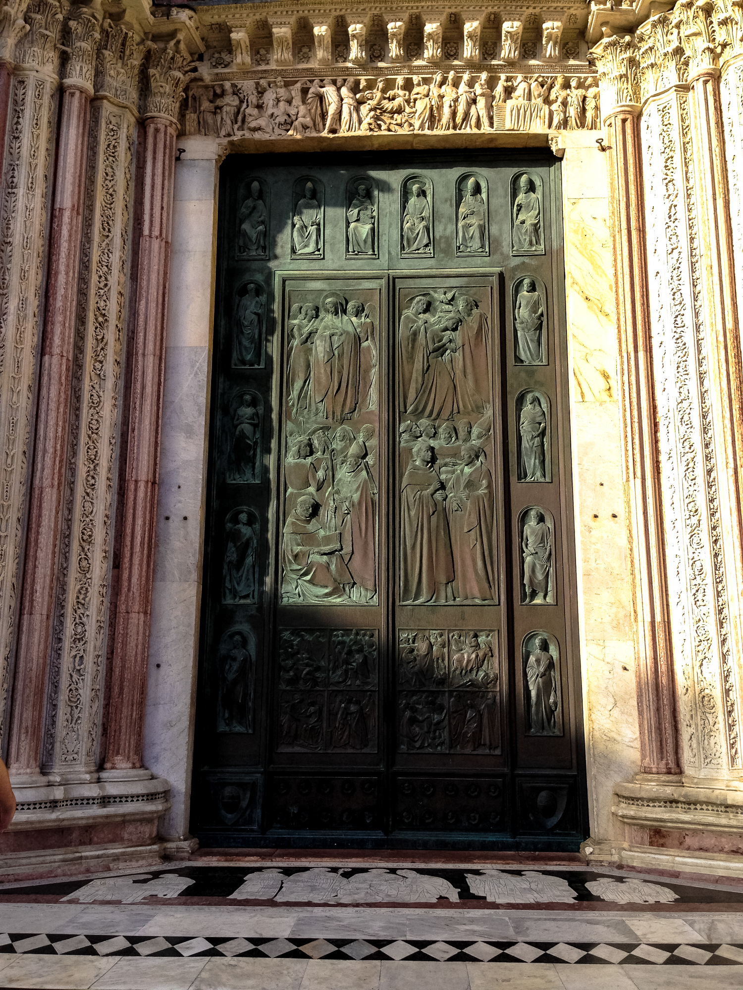 large doorway in a stone building with intricate decorations